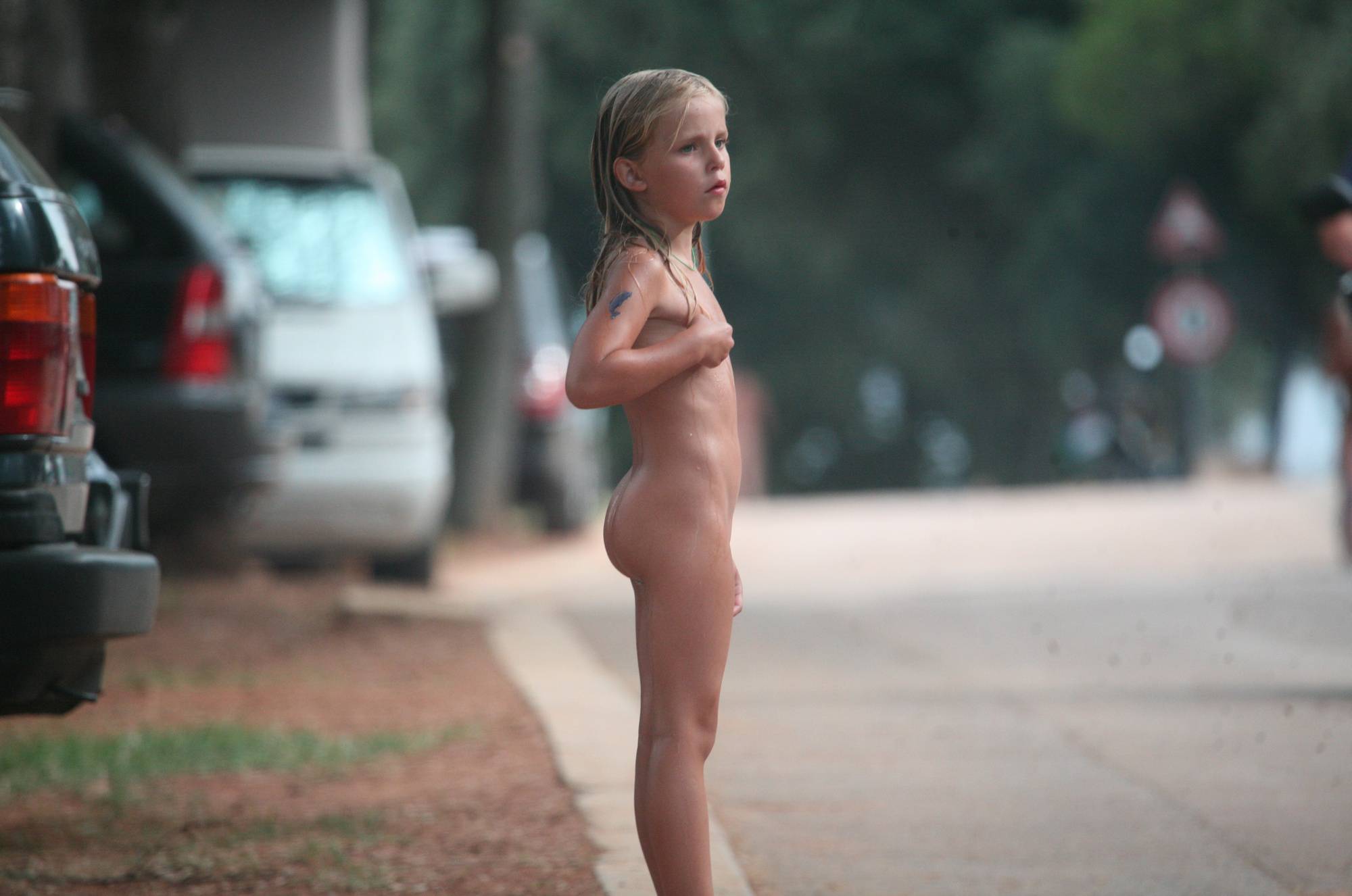 Naturist Child on Sidewalk - 2
